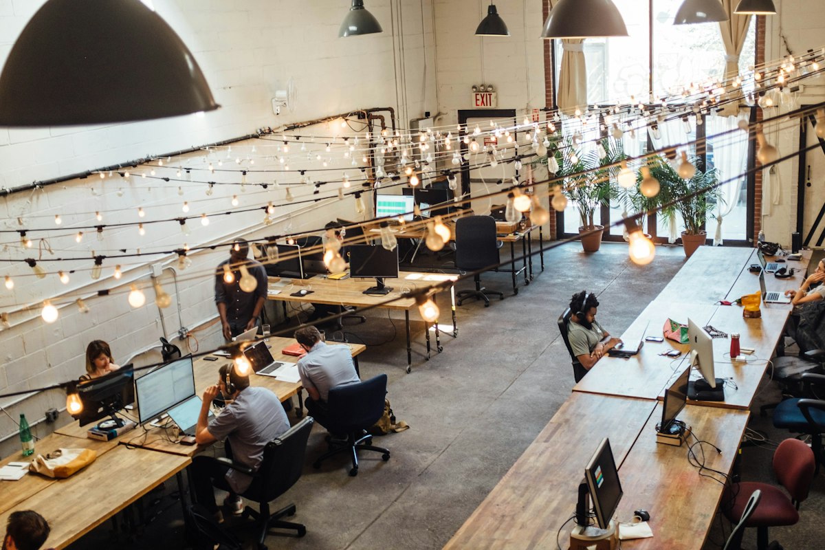 Members working and talking in a shared coworking space