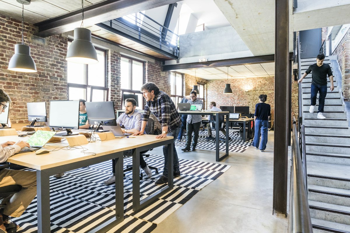 Founders collaborating around a table in a startup office